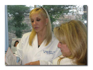 Sara Ribak, MSN FNP Certified Specialist & CEO consulting with a new patient